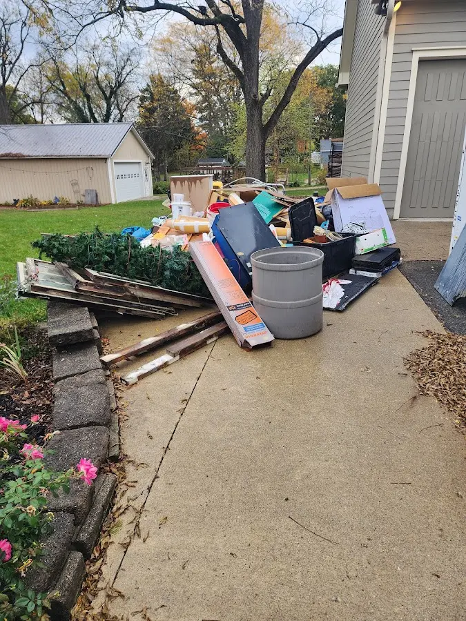 Dumpster being loaded with debris for Demolition Dumpster Rental in Montville